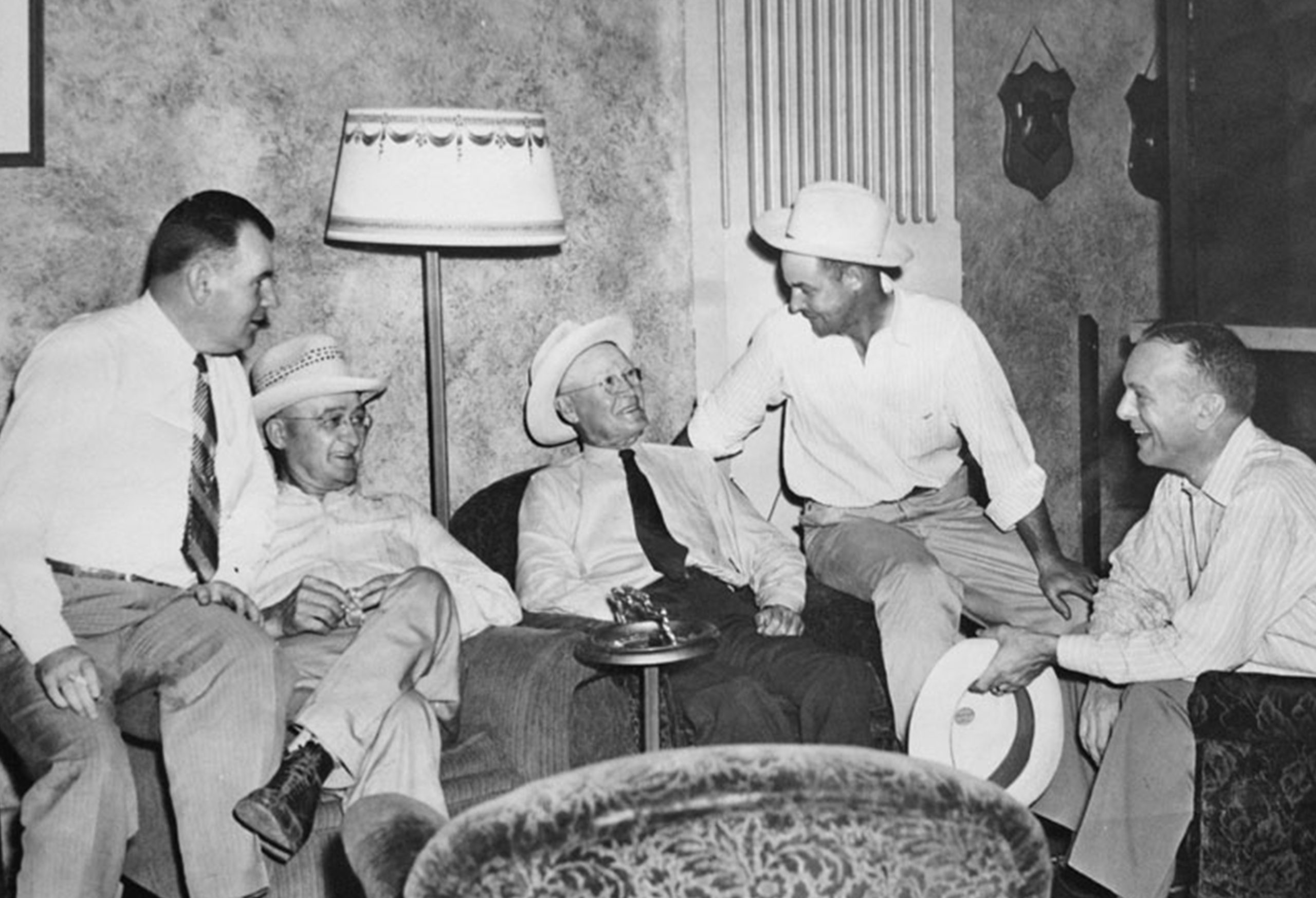 Evan Jones and Friends sitting in a living room laughing together